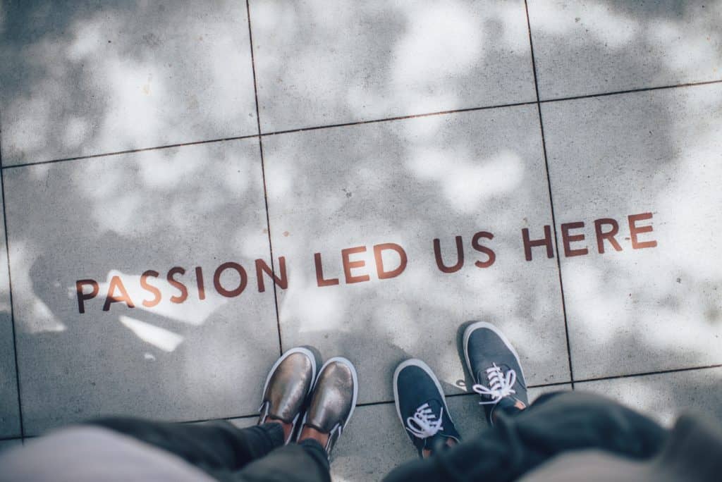 a photo on a sentence on the ground "passion led us here"