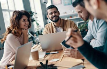 a group of people sitting around a table