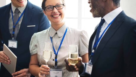 a group of people holding wine glasses