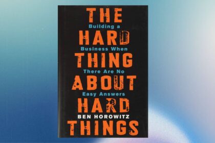 a book cover with orange and blue text