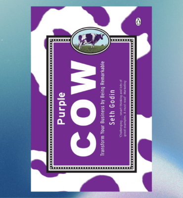 a purple and white cow book cover